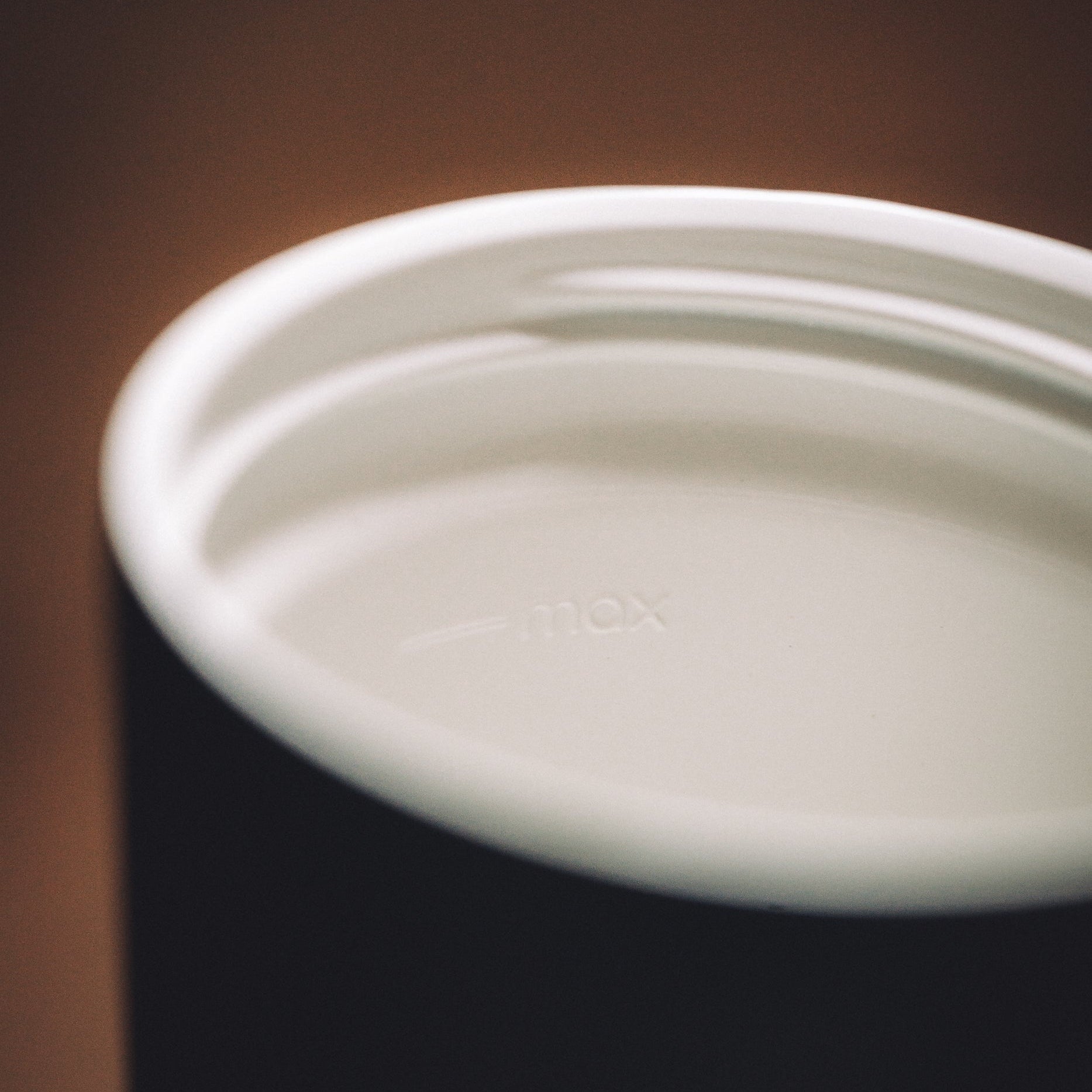 Bru-Cups travel mug with close-up of ceramic lining.